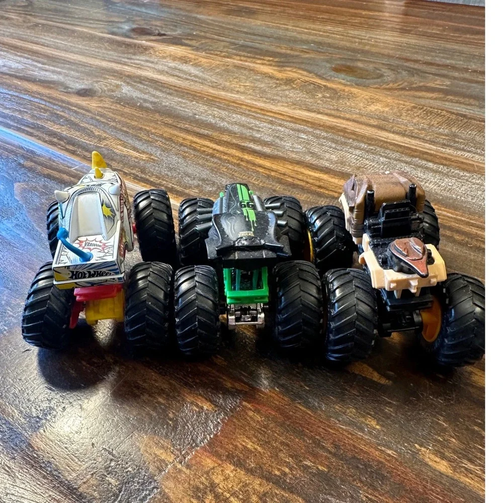 Monster Jam Truck HotWheel Lot of 3 1:64  Rhinomite Jurassic World Radical Racer